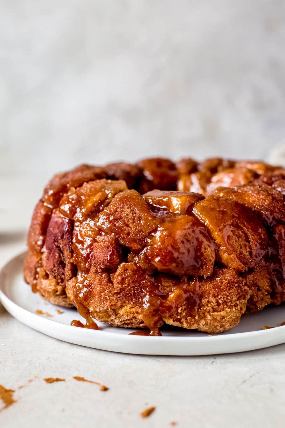 Monkey Bread is a gooey glaze covered biscuits baked together with a caramelized topping